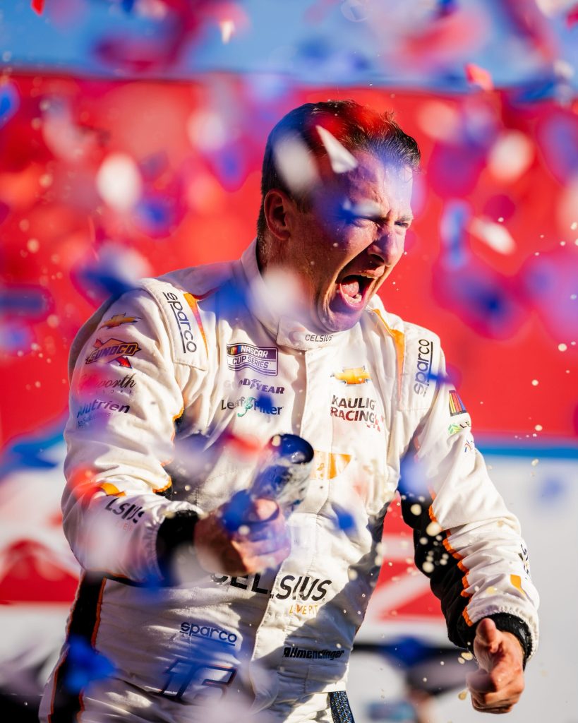 AJ Allmendinger celebrates in Victory Lane