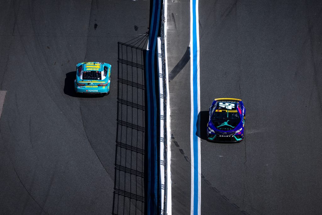 Denny Hamlin, left, and Tyler Reddick race in the NASCAR Cup Series at the Charlotte road course