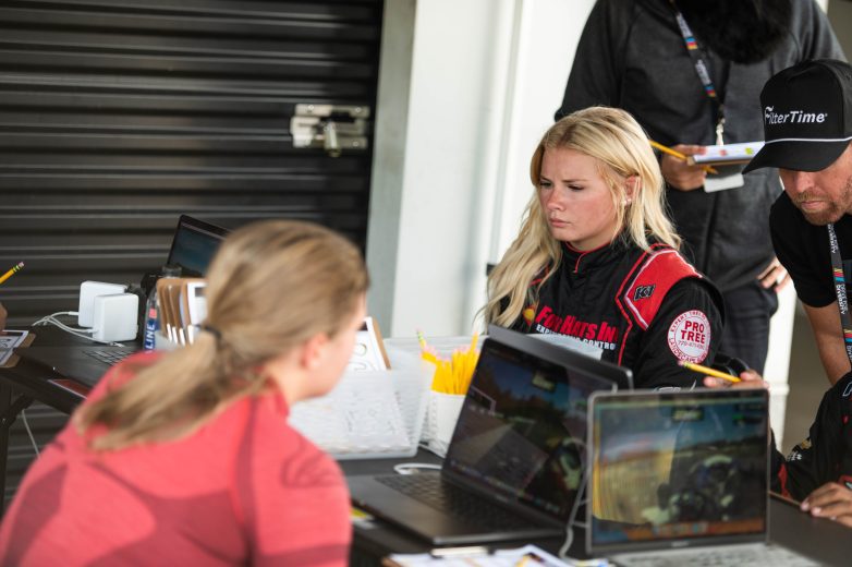 Driver Lanie Buice studying data during the Drive for Diversity Combine at Trackhouse Motorplex