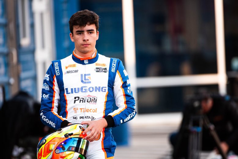 Arthur Gama walks to the grid with his helmet as he prepares for practice at Trackhouse Motorplex