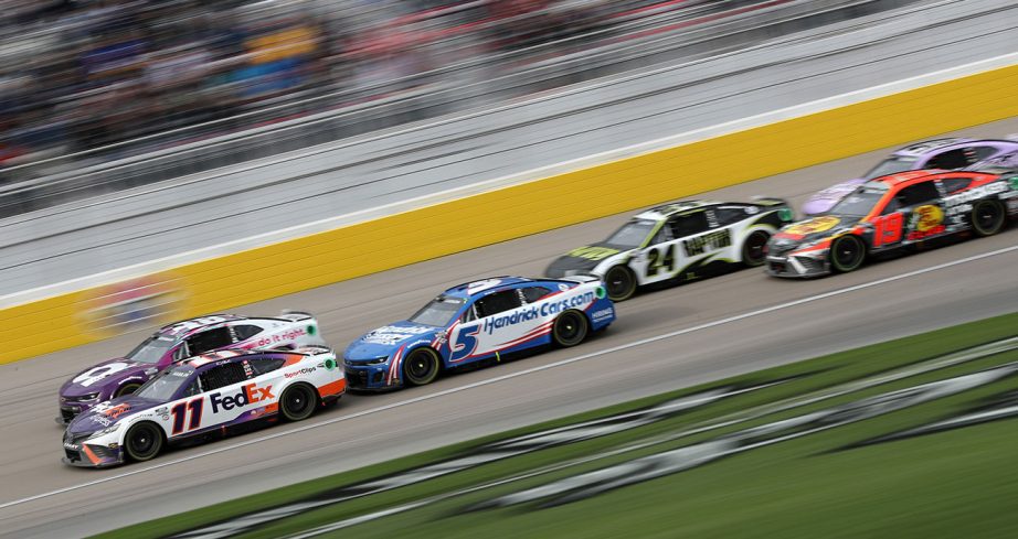 NASCAR cars racing at Las Vegas Motor Speedway.