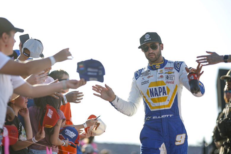Chase Elliot gives high fives to fans