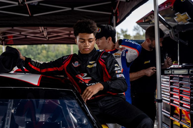 Caleb Johnson climbing out of the car at the Advance Auto Parts Drive for Diversity Combine at Florence Motor Speedway