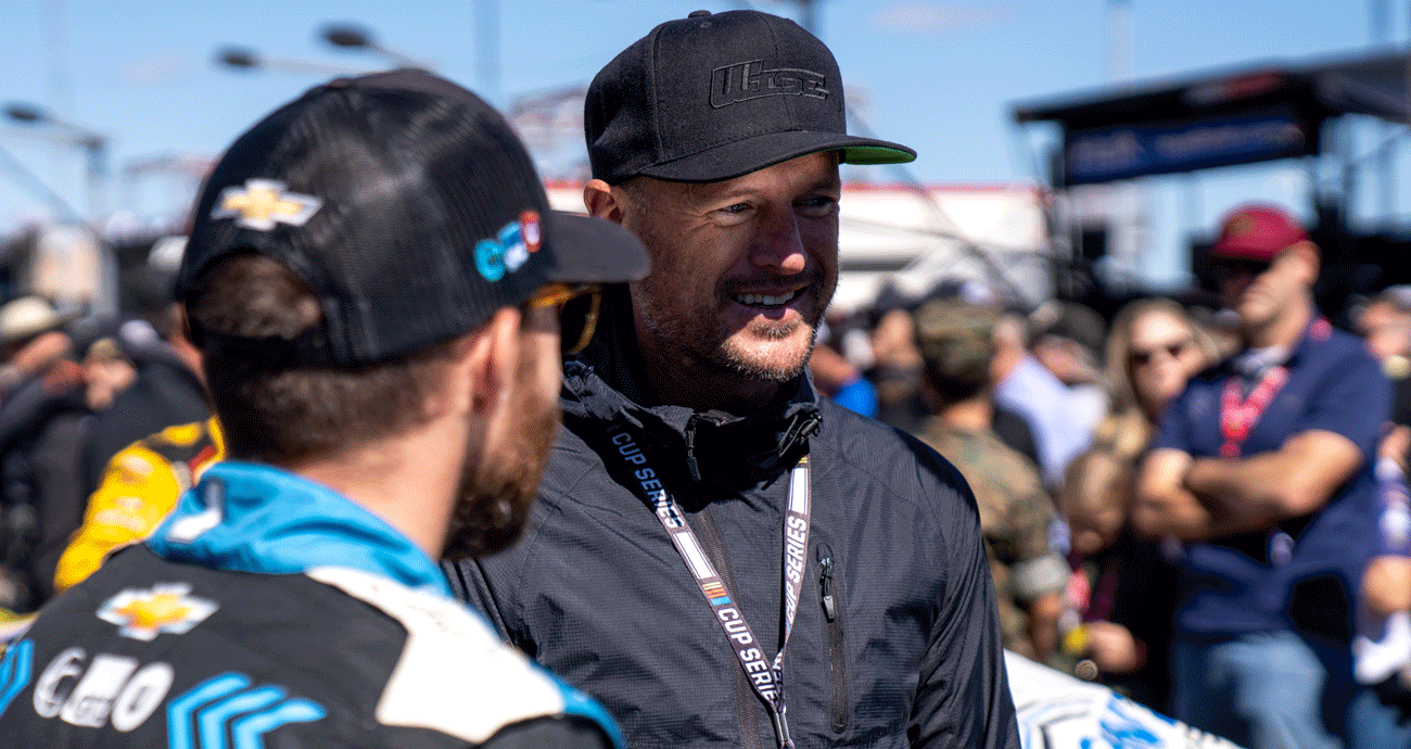 Josh Wise chats with Ross Chastain on the grid at Charlotte Motor Speedway
