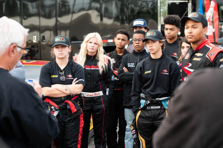 Drivers look on as the get instruction before on track activity at Florence Motor Speedway
