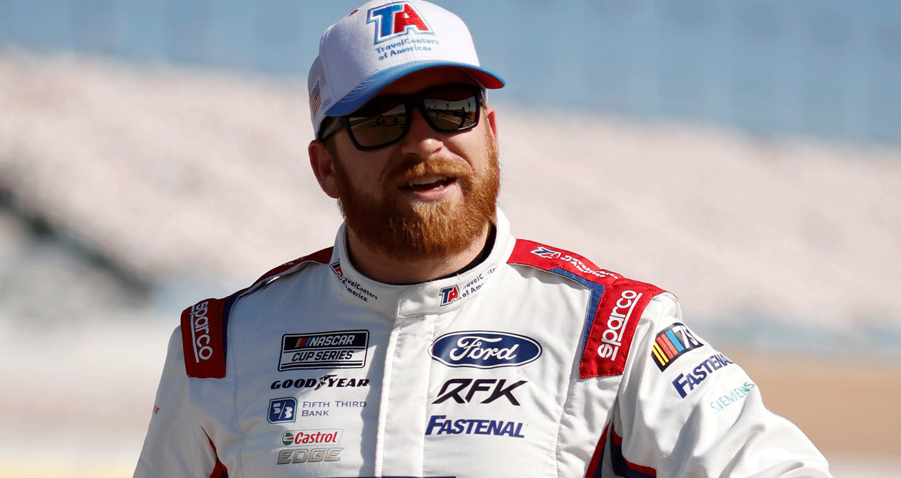 Chris Buescher walks on the grid during qualifying at Las Vegas Motor Speedway