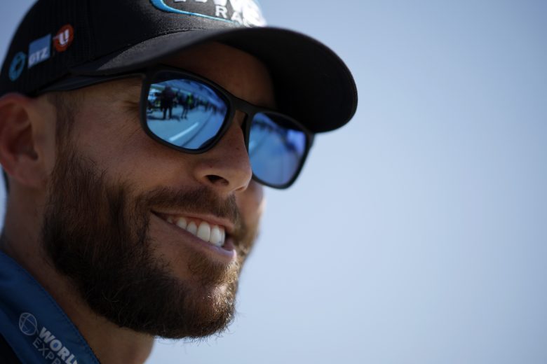 Ross Chastain smiling at the track during practice