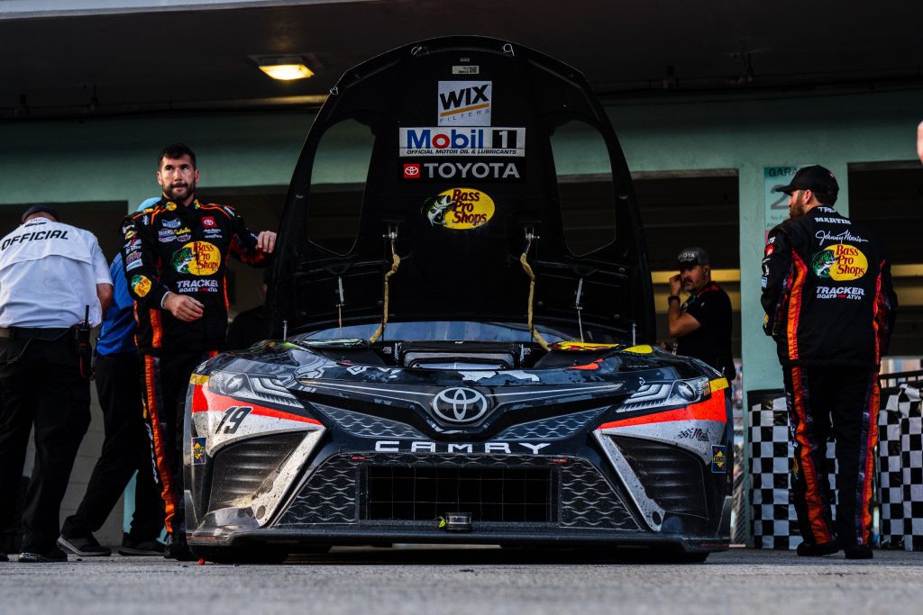 The No. 19 Toyota sits in the garage with its hood up after a blown engine in the NASCAR Cup Series race at Homestead-Miami