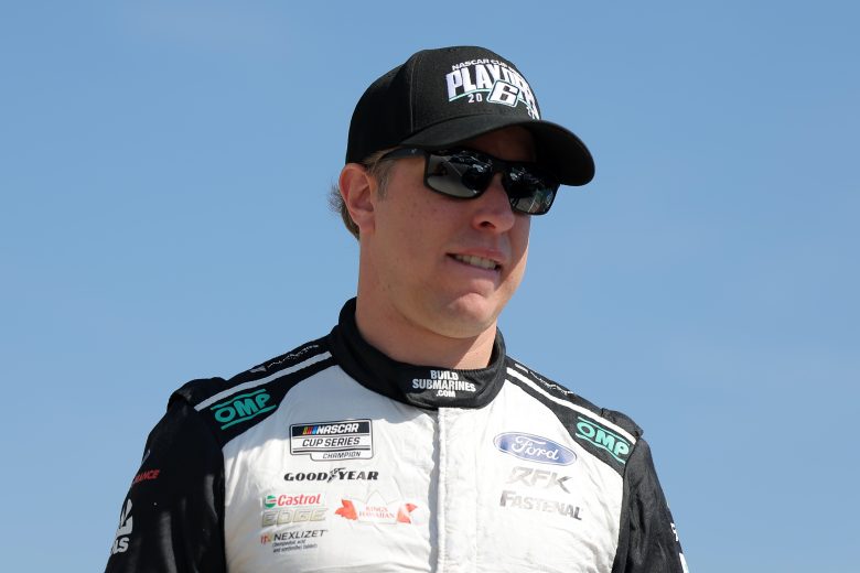Brad Keselowski walks the grid.