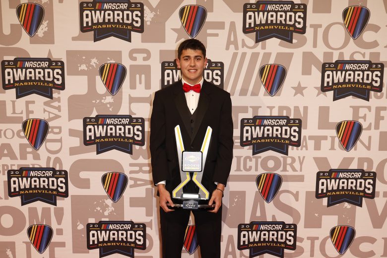 Sammy Smith poses for photos with the 2023 NASCAR Xfinity Series Sunoco Rookie of the Year trophy