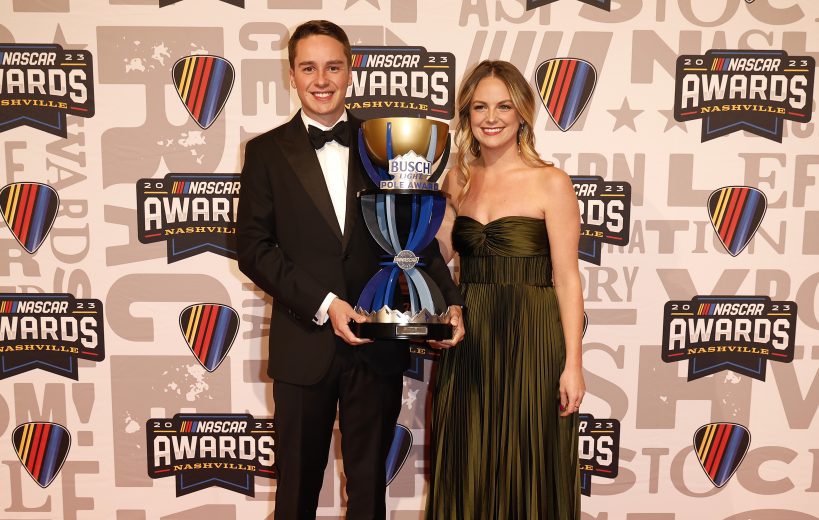 Christopher Bell poses for photos with the Busch Light Pole Award trophy on the red carpet