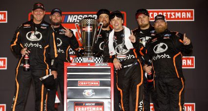 Ben Rhodes, driver of the No. 99 Kubota Ford, and crew celebrate in victory lane after winning the 2023 NASCAR Craftsman Truck Series Championship at Phoenix Raceway.