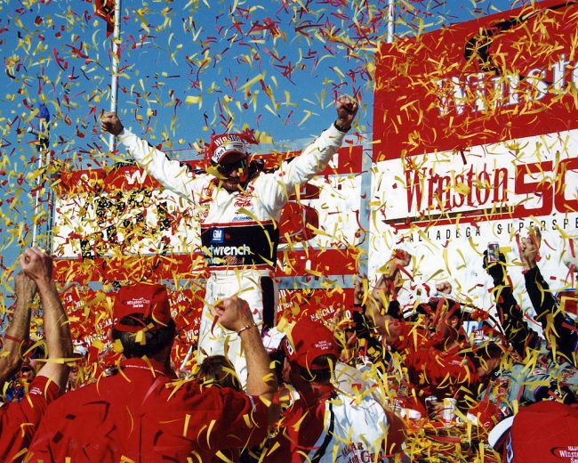 Dale Earnhardt celebrates in Victory Lane at Talladega Superspeedway.