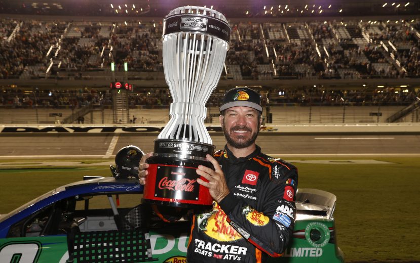 Martin Truex Jr. hoist regular season trophy.