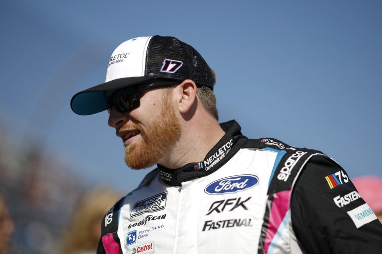 Chris Buescher looks on.