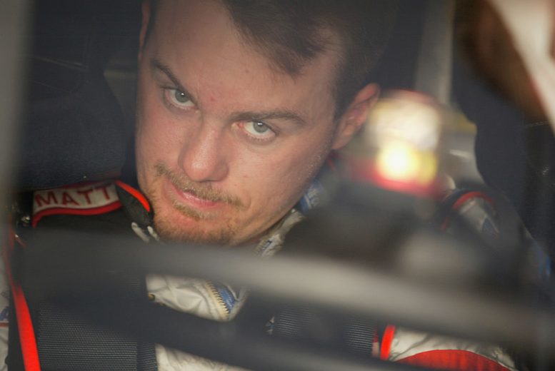 Kevin Harvick looks on.