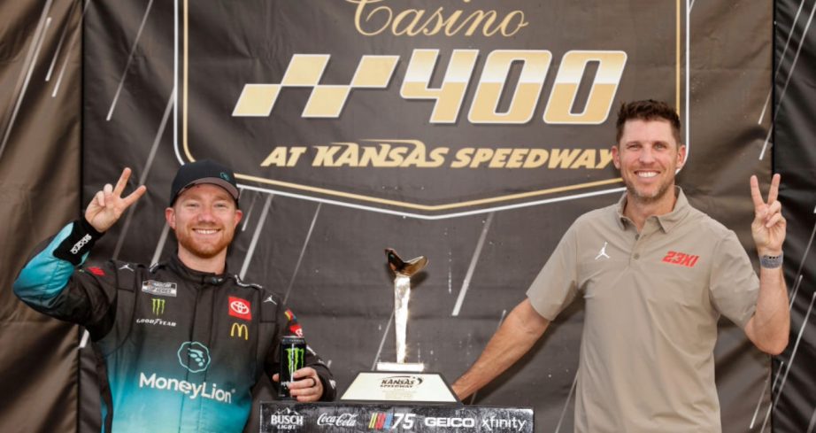 Tyler Reddick celebrates in Victory Lane at Kansas.