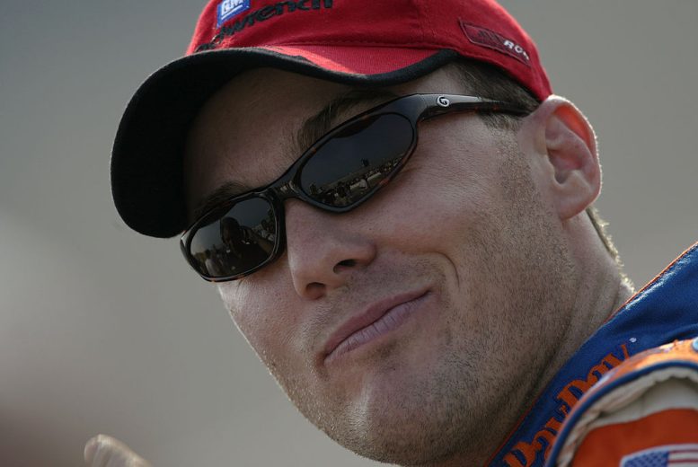 Kevin Harvick looks on.