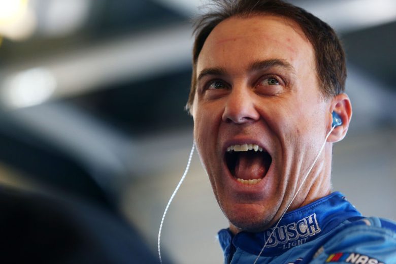 Kevin Harvick looks on and laughs.