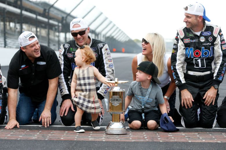 Kevin Harvick kisses the bricks after winning at Indianapolis.