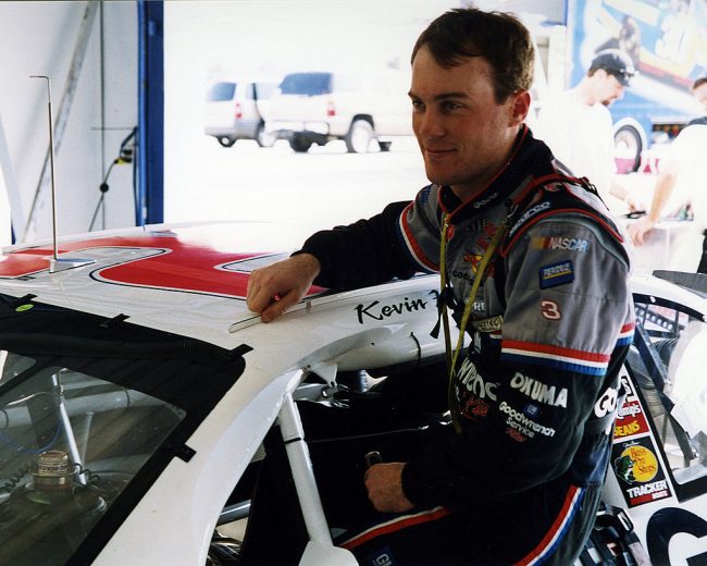 Kevin Harvick looks on.
