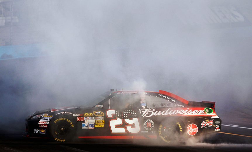 Kevin Harvick does a burnout after winning at Phoenix.