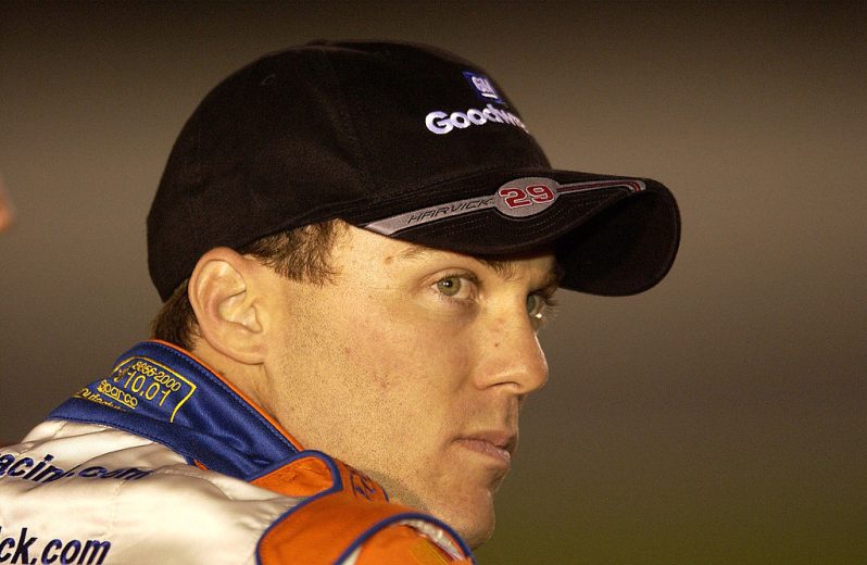 Kevin Harvick looks on.