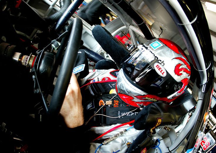 Kevin Harvick sits in his car.