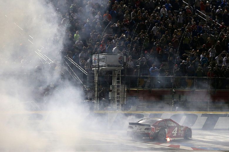 Kevin Harvick does a burnout after winning at Charlotte.