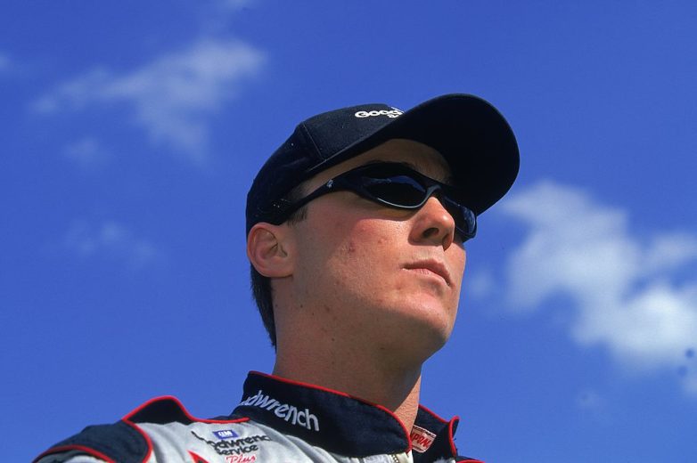 Kevin Harvick looks on.