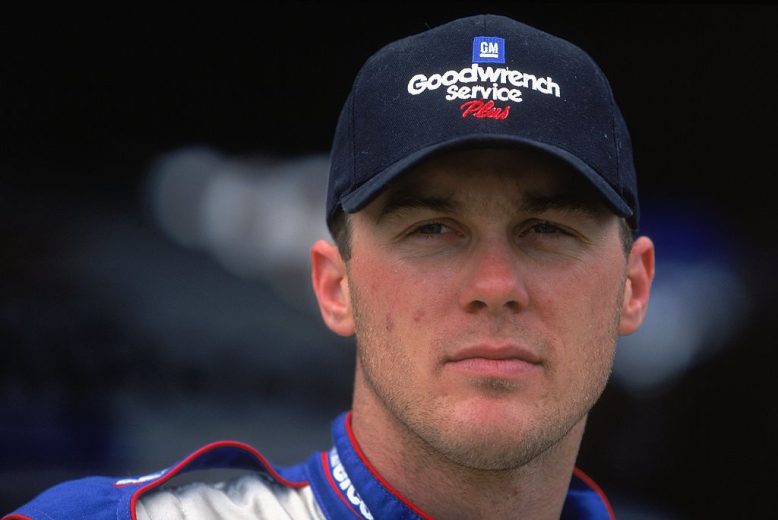 Kevin Harvick looks on.