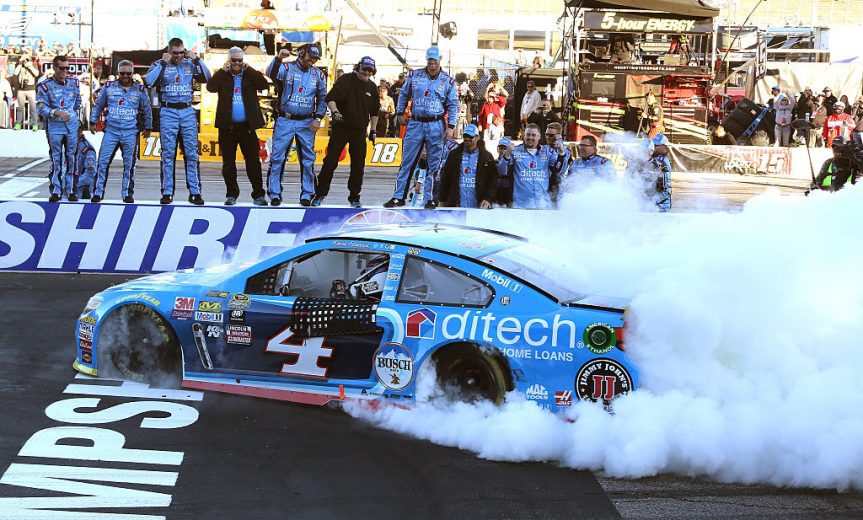 Kevin Harvick celebrates in Victory Lane at New Hampshire.
