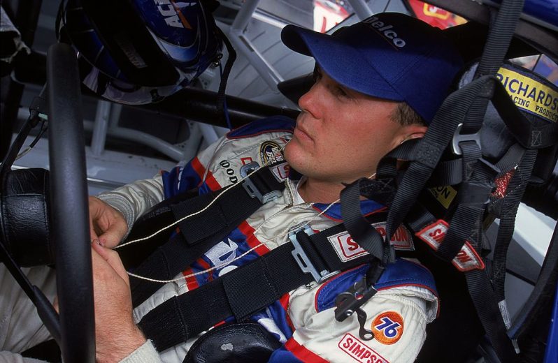 Kevin Harvick looks on.