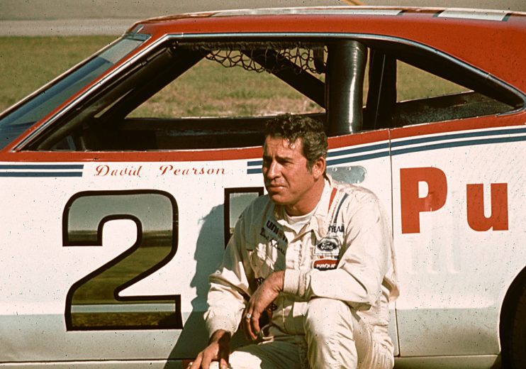 David Pearson poses next to race car