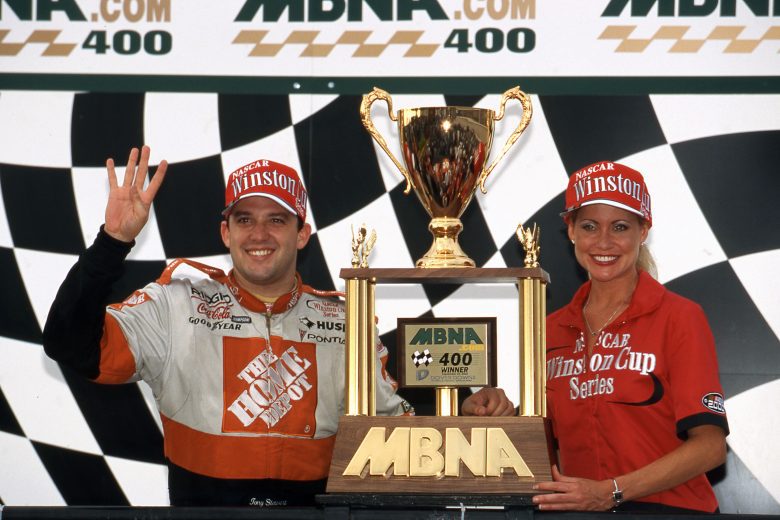 Tony Stewart poses with trophy in Victory Lane.