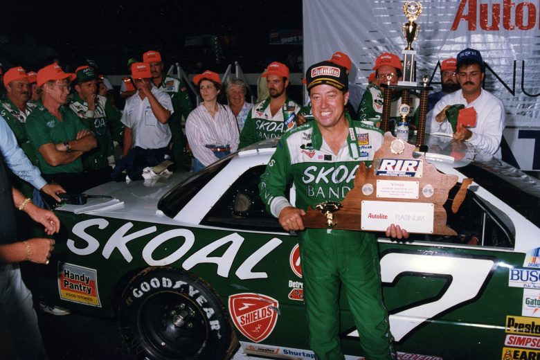 Harry Gant holds trophy in Victory Lane