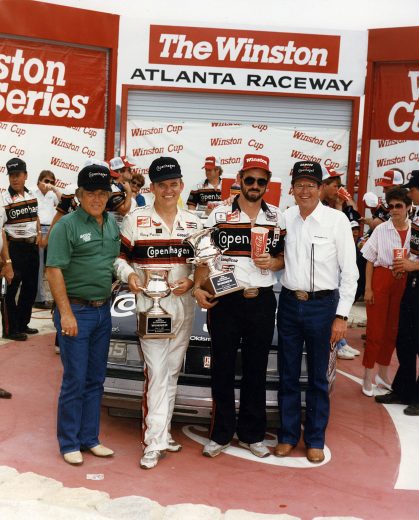 Benny Parsons holds trophy in Victory Lane.