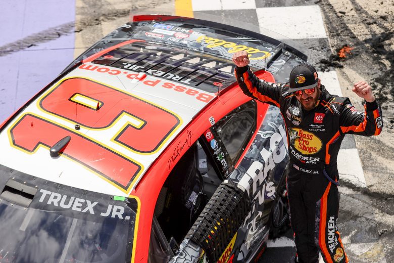 Martin Truex celebrates at star/finish line