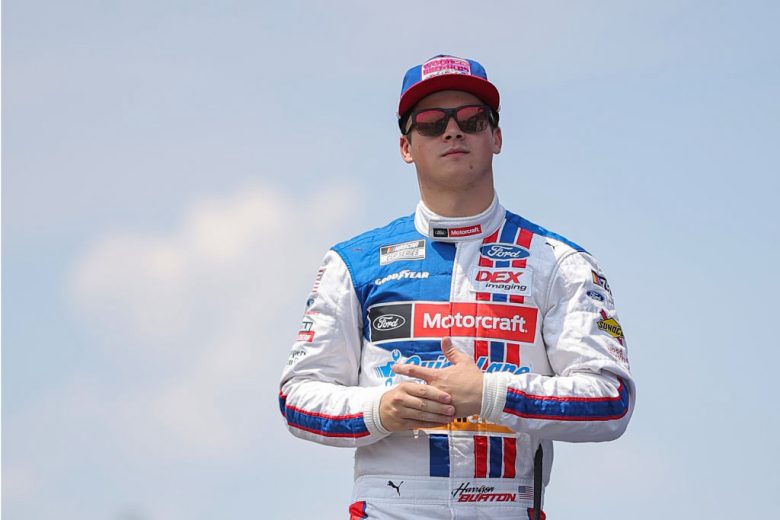 Harrison Burton looks on.