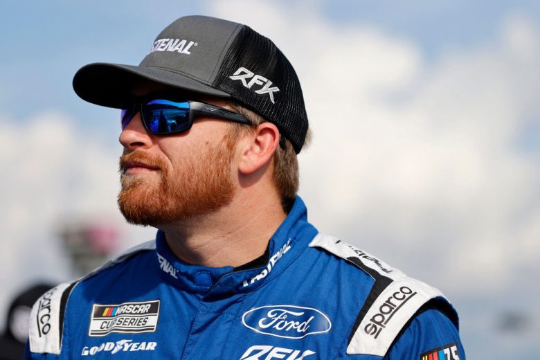 Chris Buescher looks on.