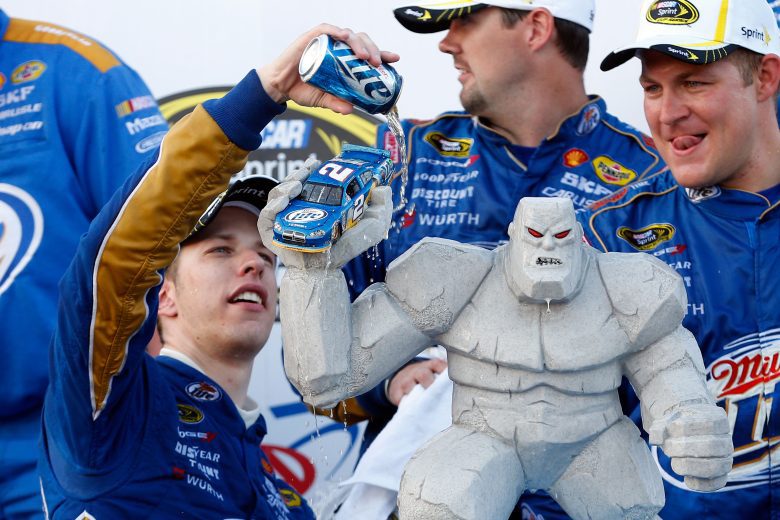 Brad Keselowski dumps beer on race winning trophy