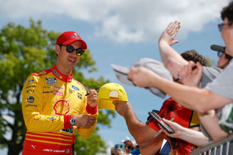 Joey Logano greets fans.