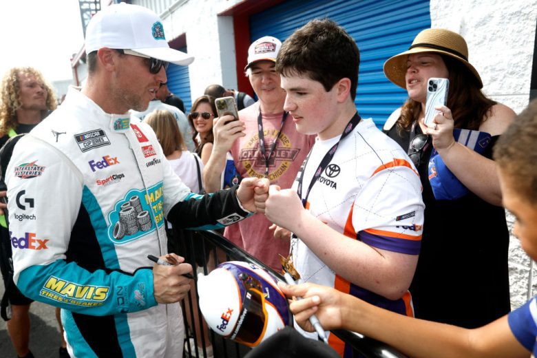 Denny Hamlin greets fans.