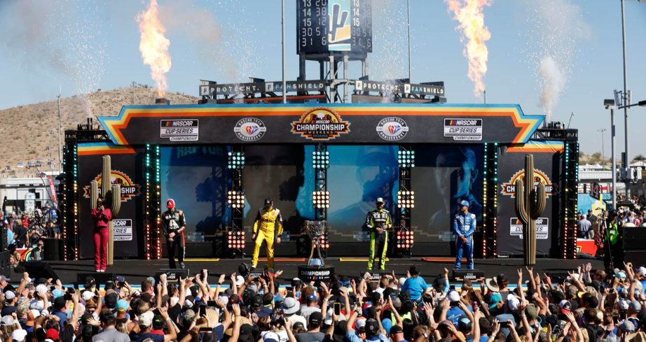 NASCAR Cup Series Championship 4 drivers stand on the stage and wave to the crowd at Phoenix Raceway.