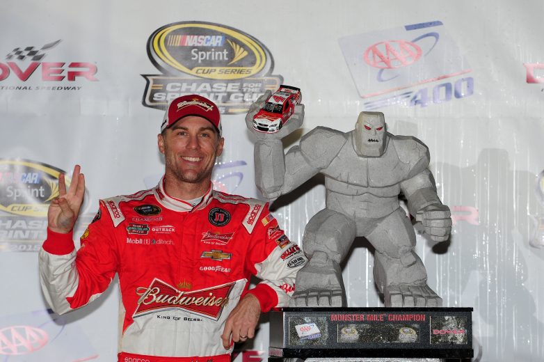 Kevin Harvick poses next trophy