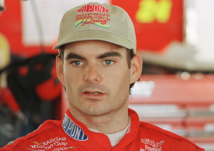 Jeff Gordon looks on.