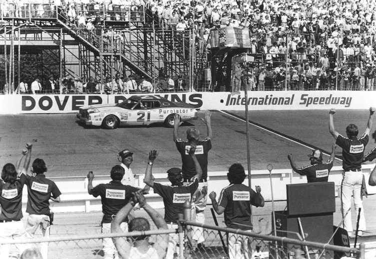 Neil Bonnett crosses the finish line at Dover International Speedway