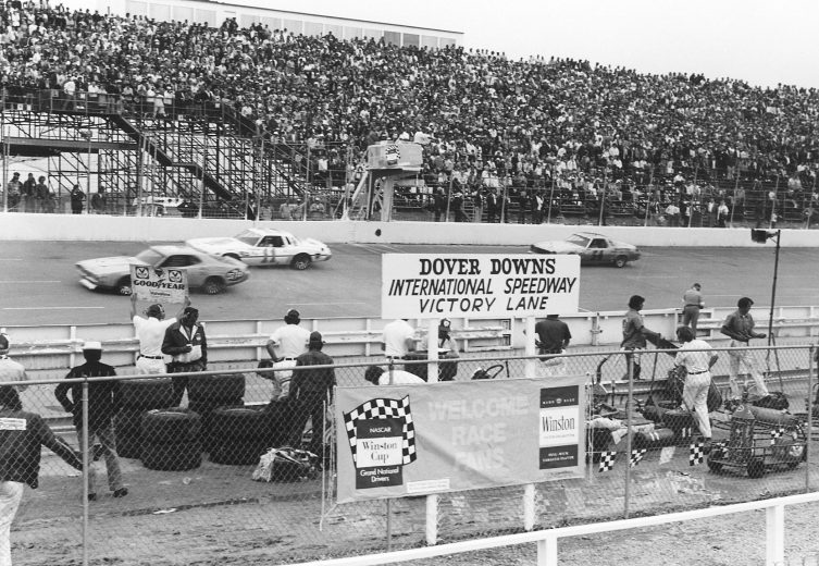Richard petty crosses the finish line at Dover International Speedway