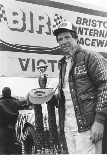 Darrell Waltrip poses with trophy in Victory Lane.