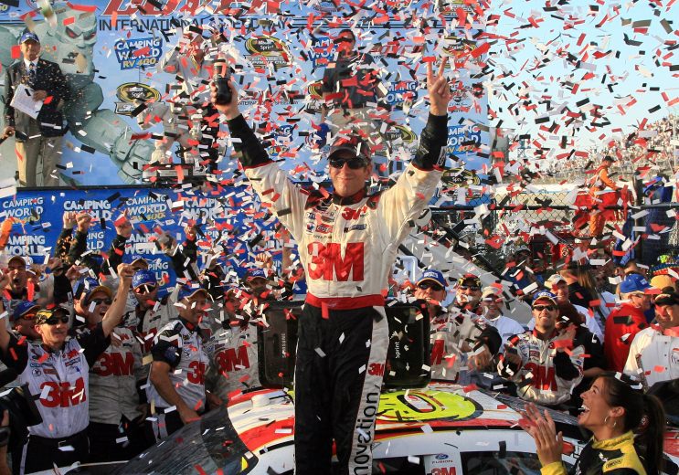 Greg Biffle celebrates in victory lane.